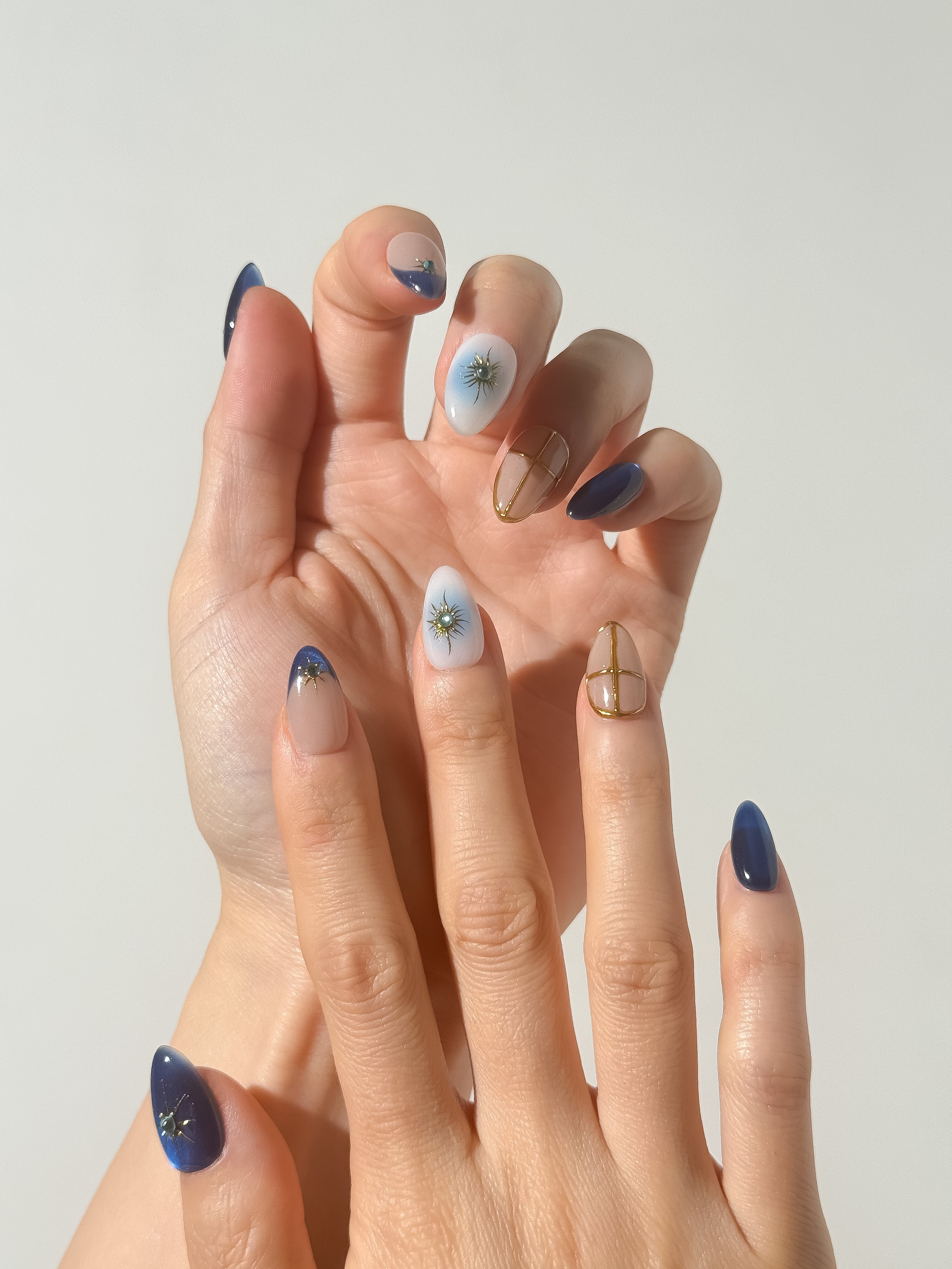Sapphire Sky press-on nails on hand
