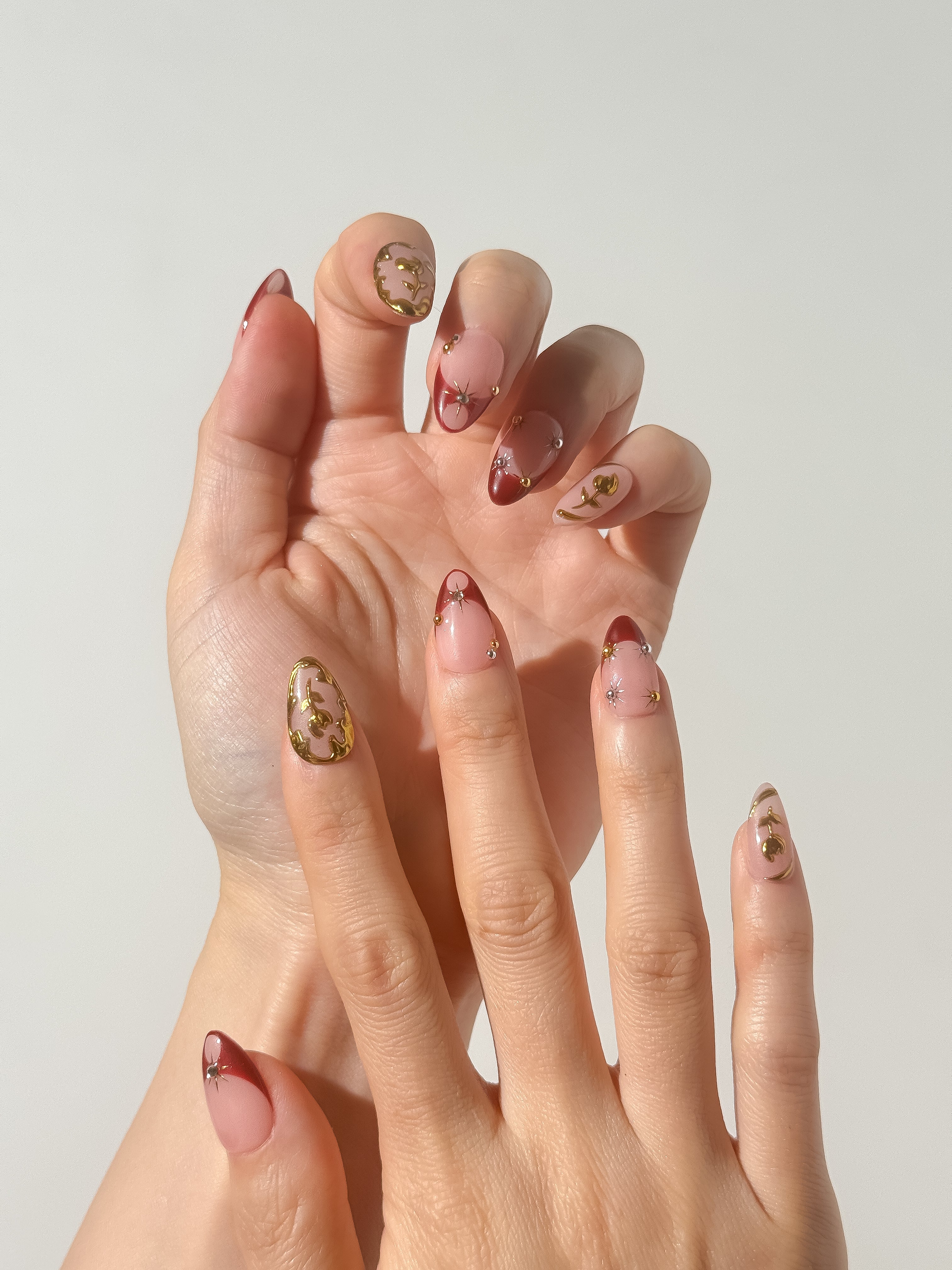 Golden Rose press-on nails on hand