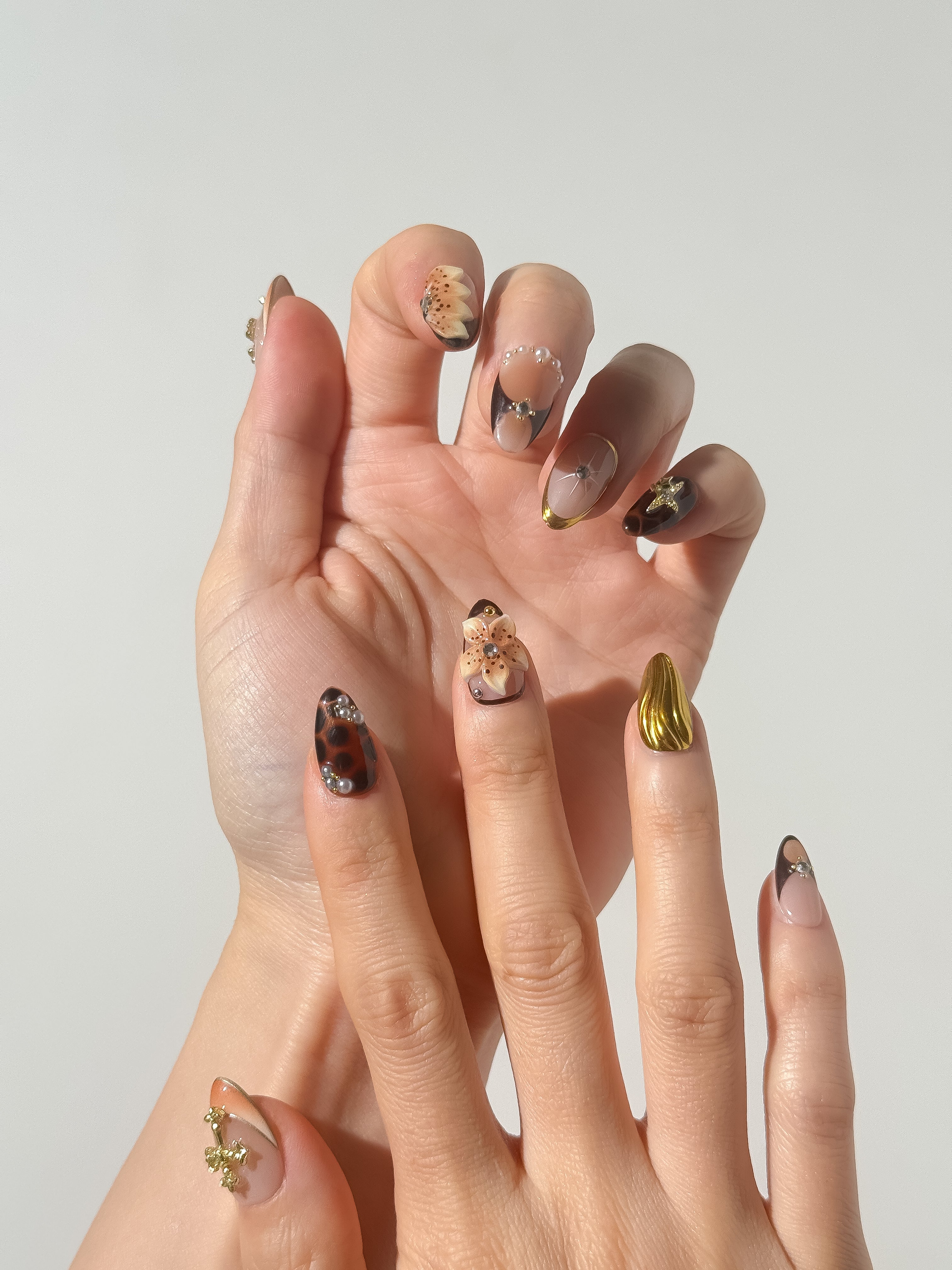 Amber Reign press-on nails on hand