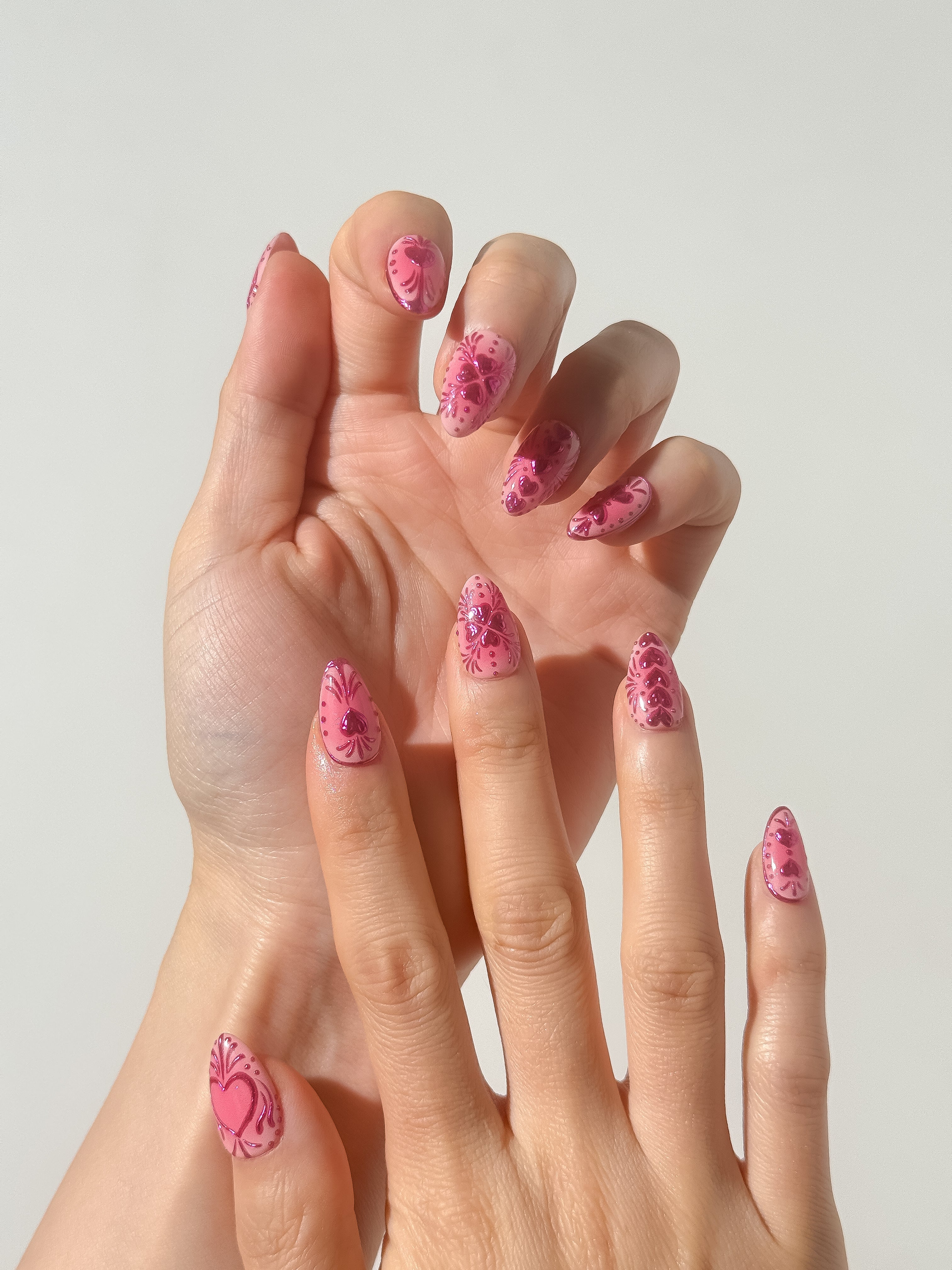 Crimson Devotion press-on nails on hand